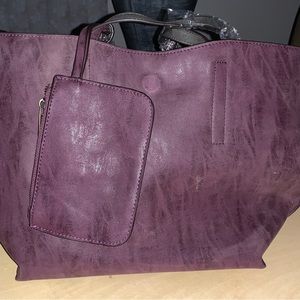 Reversible purple and gray tote with a wristlet